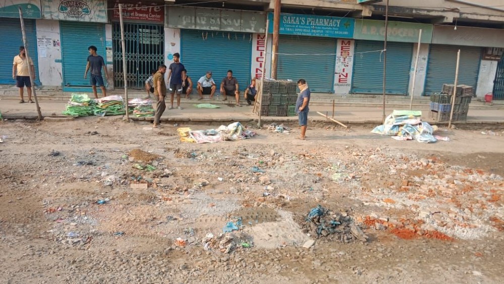 Residents of Industrial Estate colony, Dimapur filled up potholes dotting a stretch of NH 36 starting from the Assam Rifles camp (old firing range) till the District Jail intersection on June 3. (Morung Photo)